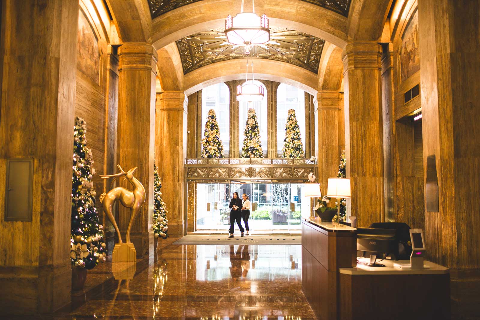 Bank lobby with holiday decorations and trees